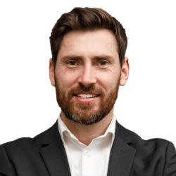 positive-male-business-coach-in-classic-suit-with-H2VK7F3.png